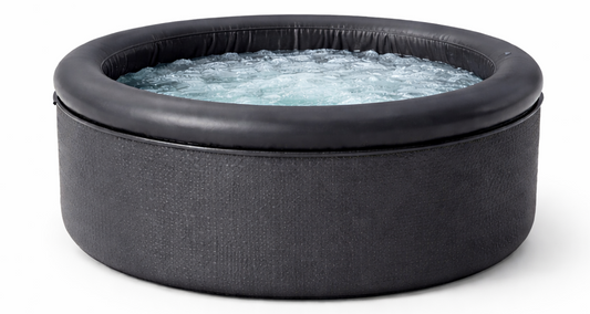 Inflatable cold plunge tub on a white background with water inside
